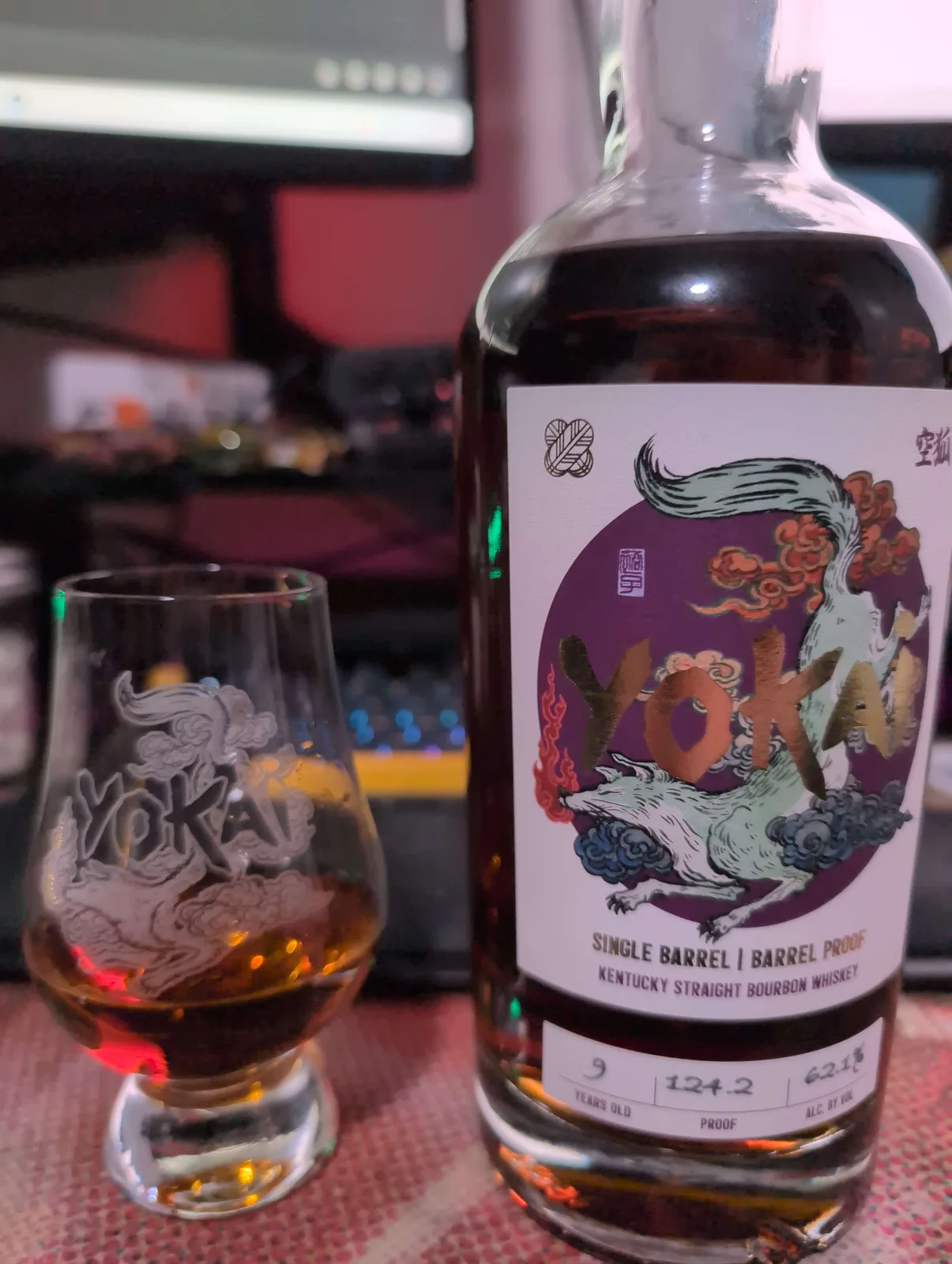 A barrel-proof Yokai bourbon beside a tasting glass